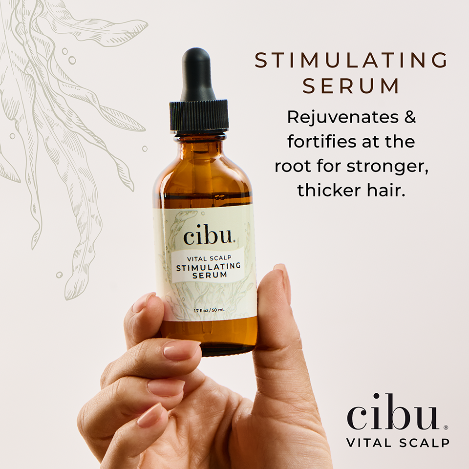 Cibu vital scalp stimulating serum bottle held by a hand with promotional text on a light background