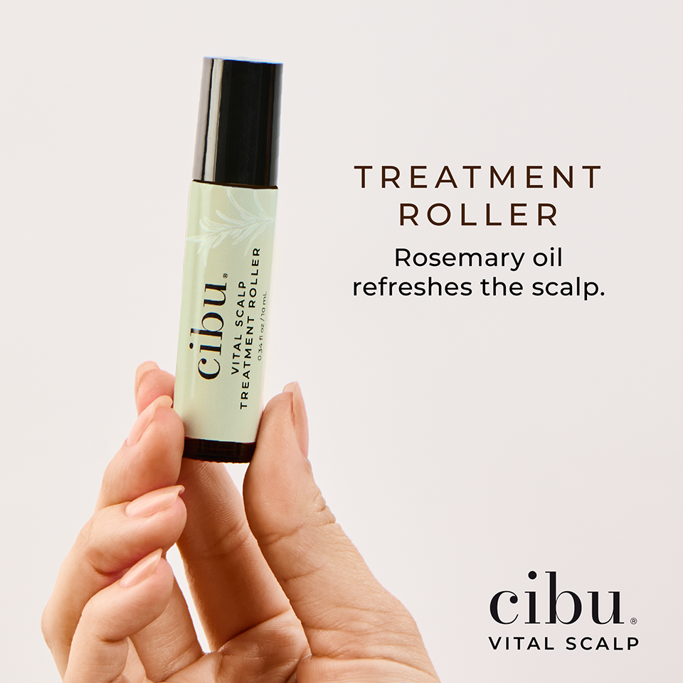 Cibu Vital Scalp treatment roller held in a hand with a light background