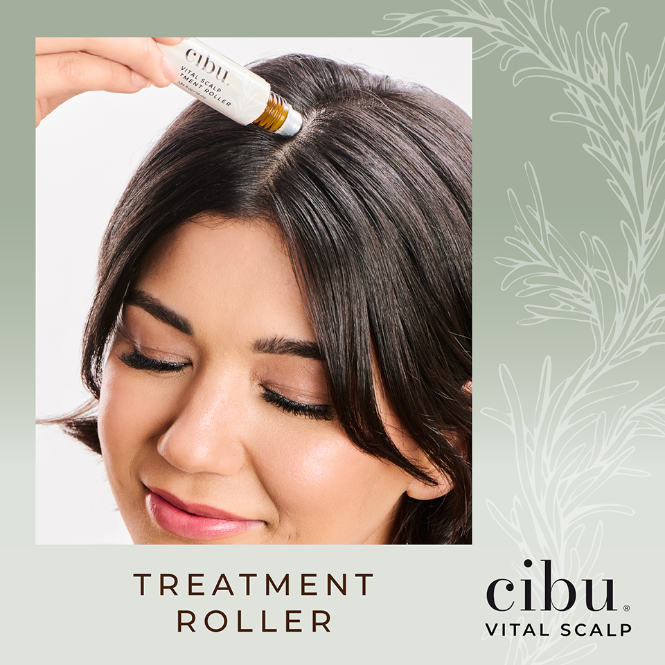 Woman using a cibu treatment roller on her hair with a light green background